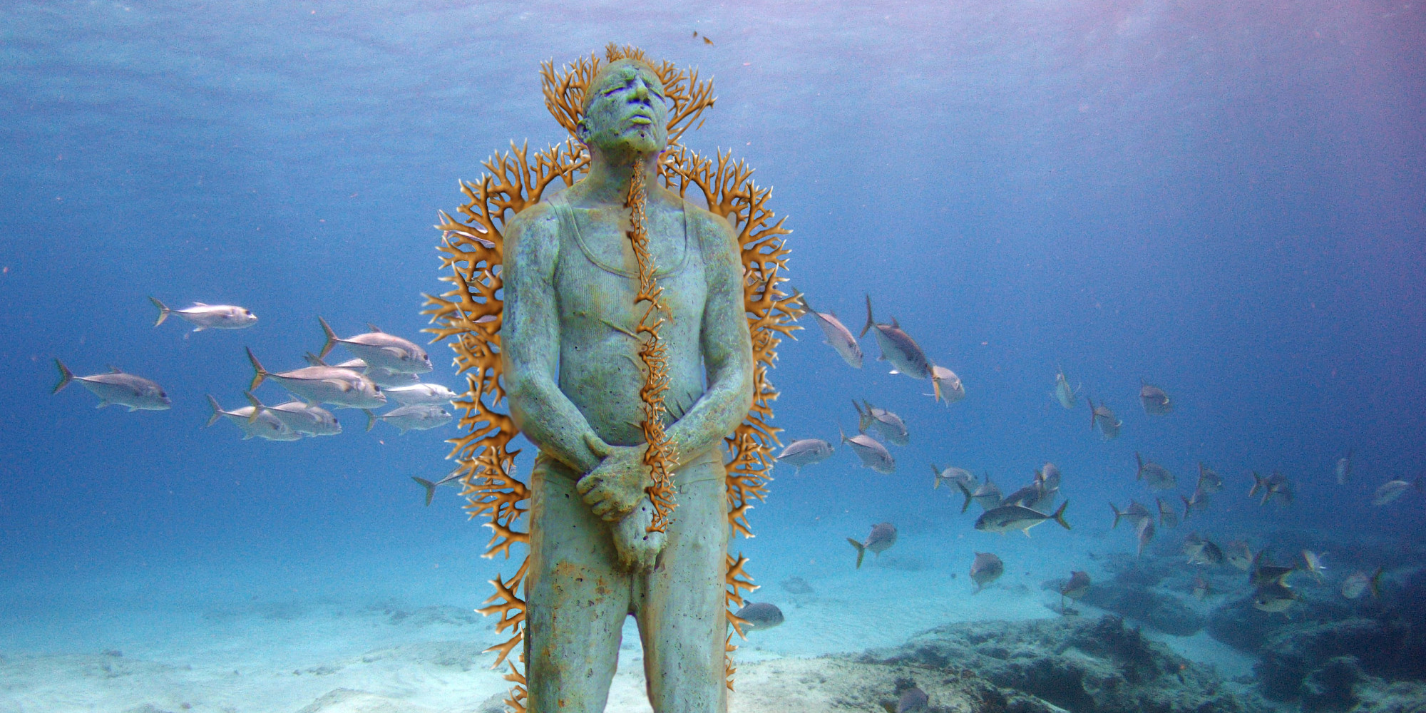 CANCUN, MEXICO - JANUARY 31: ***EXCLUSIVE*** Hombre en Llamas (Man on Fire) depicts a lone figure standing upright and defiant. The sculpture is installed 8m deep in the clear Caribbean waters surrounding the island of Isla Mujeres at a location named Manchiones. The cement figure has been drilled with over 75 holes and is currently being planted with live cuttings of fire coral (Millepora alcicorni). January 31, 2005. Deep under the seas of the Mexican Caribbean these statues look like relics of an ancient civilisation. Located in the National Marine Park, on the west coast of Isla Mujeres, Punta Cancun and Punta Nizuc, it will be the world's largest undetwater sculpture museum. Showing three life size sculptures are the first of 400 that will be laid on the seabed over the next 13 months. Founded by Jaime Gonzalez Cano of The National Marine Park, Roberto Diaz of The Cancun Nautical Association and renowned British underwater sculptor Jason deCaires Taylor, the underwater museum is designed to celebrate the Mayan history of the region and act as an artificial reef. (Photo by Jason de Caires / Barcroft Media / Getty Images)